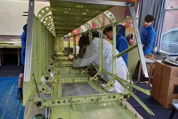 Students working on the Savannah fuselage