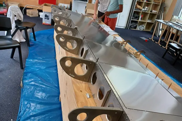 Students working on the wing
